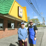 owner and gm in front of Mario's Fish Bowl in Westover